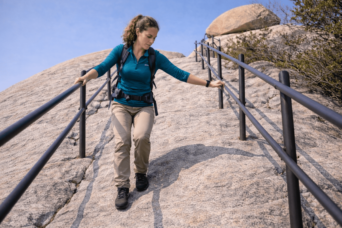Bukhansan hiking — hiker descending Baegundae granite with steel railing