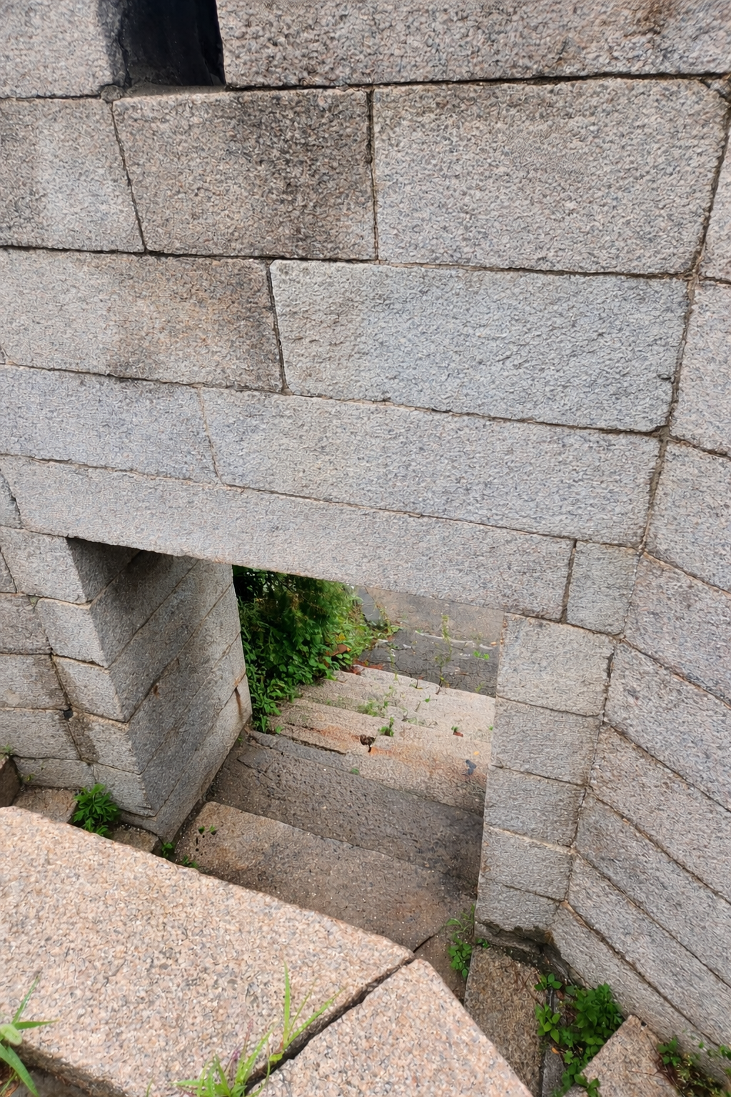 burnout warning signs — ancient Korean fortress wall with narrow passage, structure endured but worn