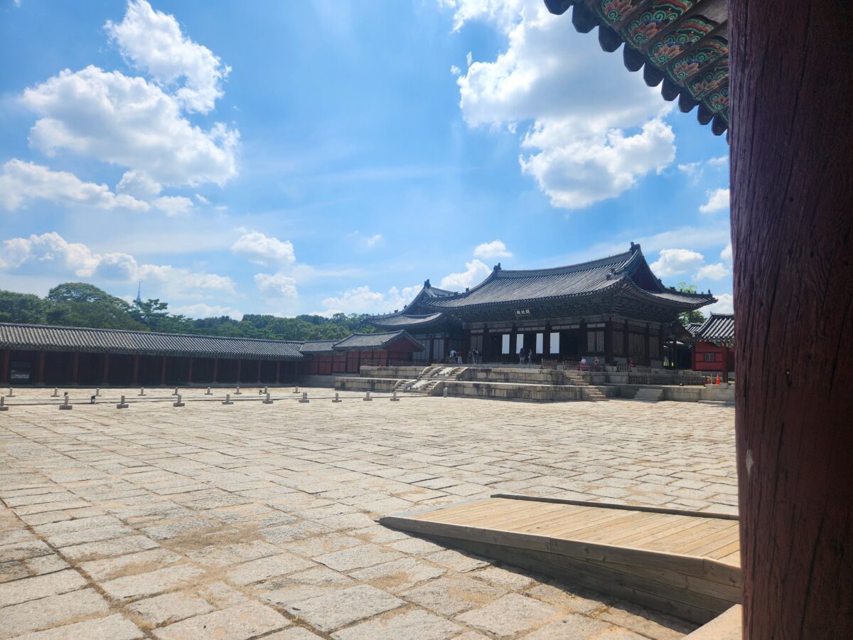 Changgyeonggung Myeongjeongjeon throne hall with wide empty stone courtyard under blue sky — Metal element K-Saju
