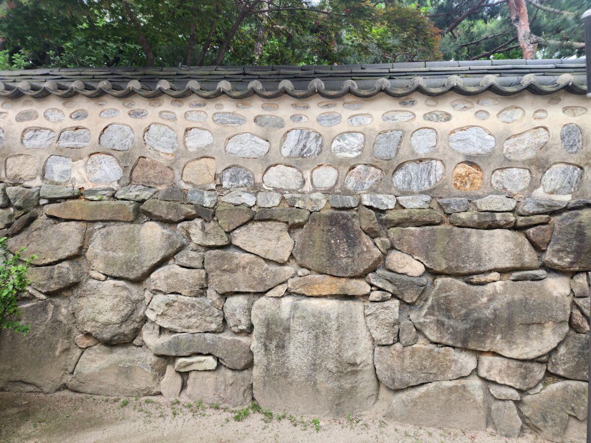 Daewoon meaning — Korean stone wall — the structural layer that holds regardless of the weather above