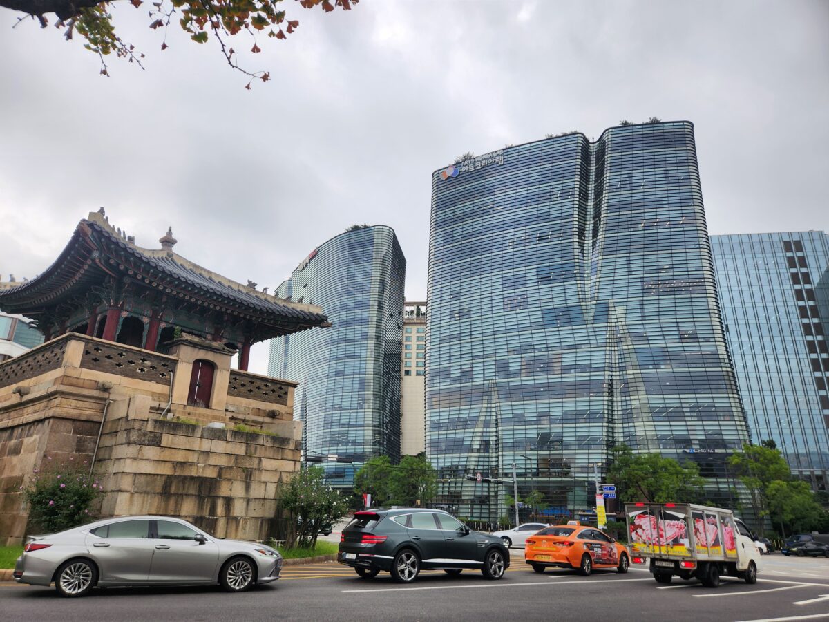 Dongsipjagak pavilion standing among modern glass buildings in Seoul — long-running pattern K-Saju