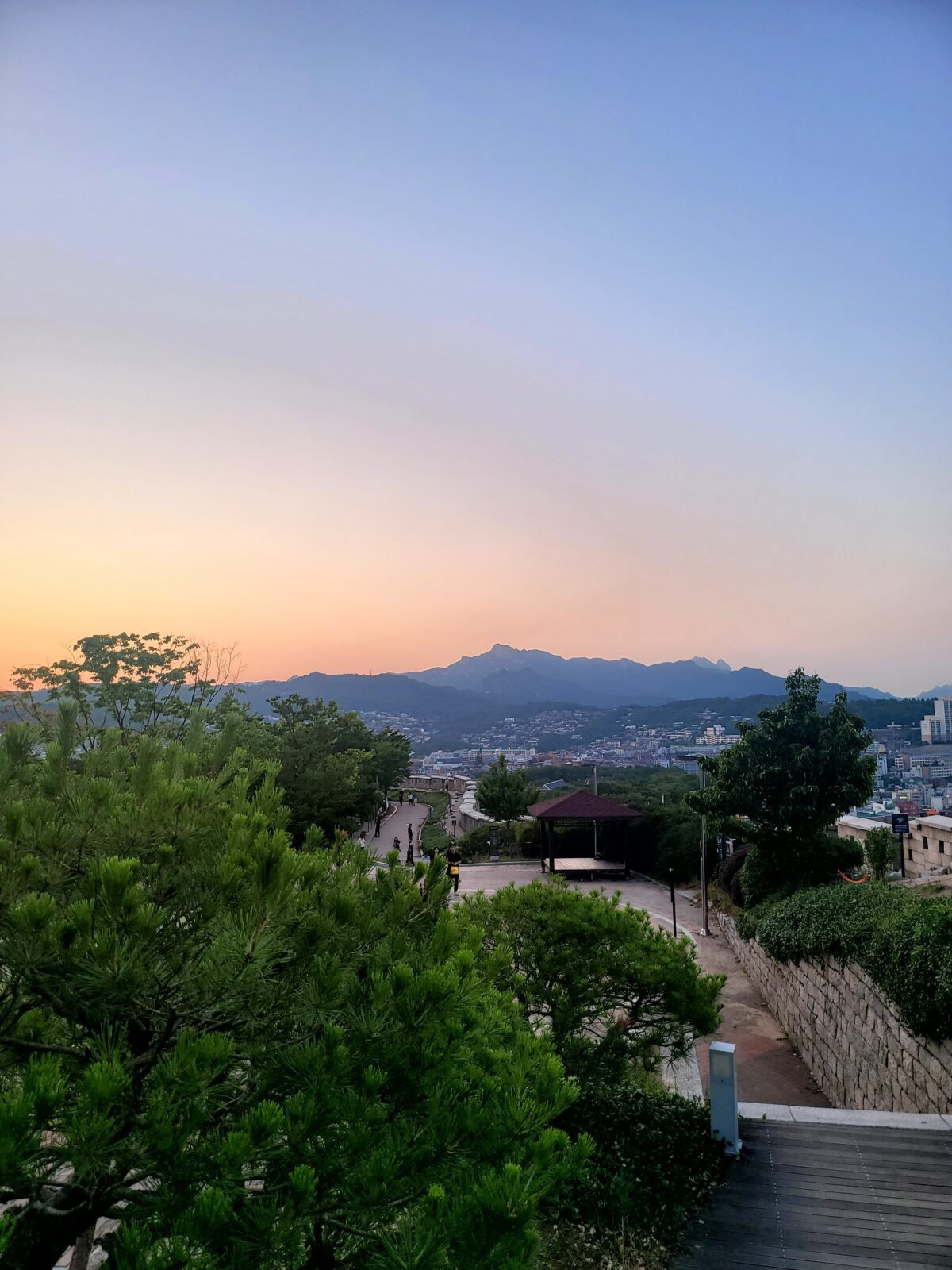 Korean fortress wall at sunset — right connection, different timing