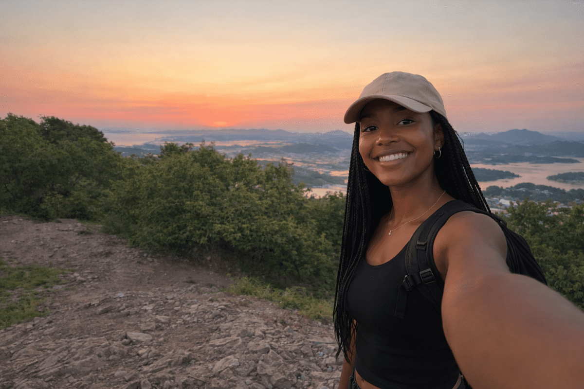 Gwanaksan hiking — hiker selfie at Yeonjudae summit with sunset view