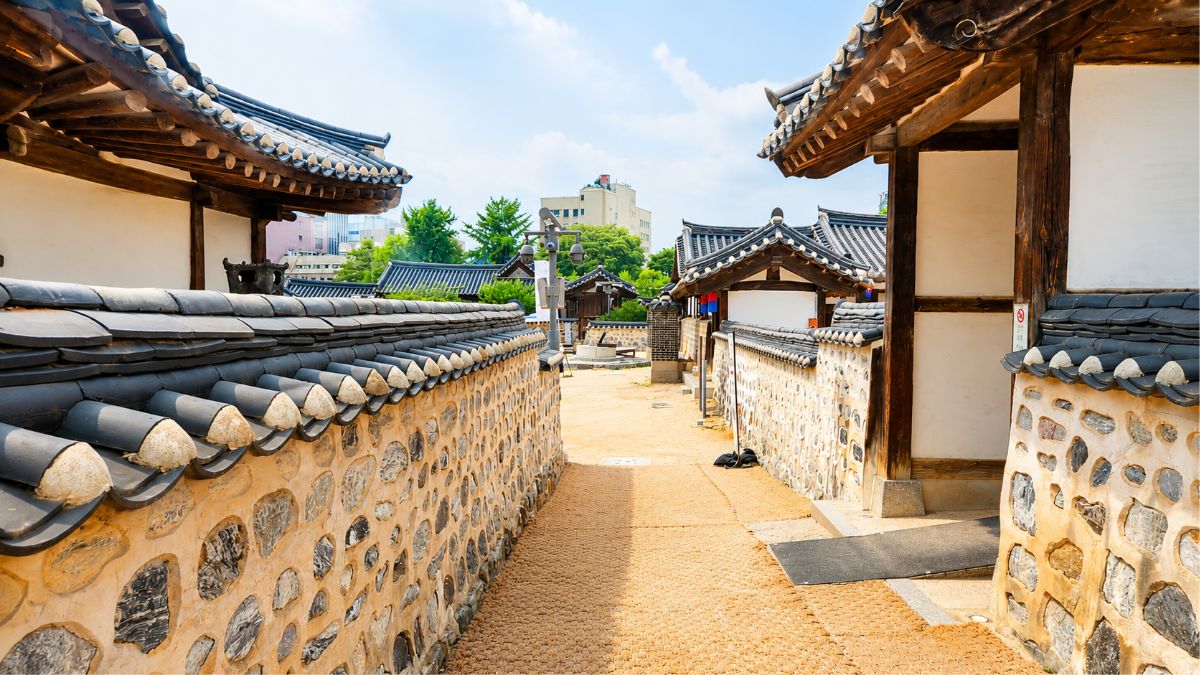 synastry compatibility — Hanok alley between stone walls Korea, two paths two seasons one relationship