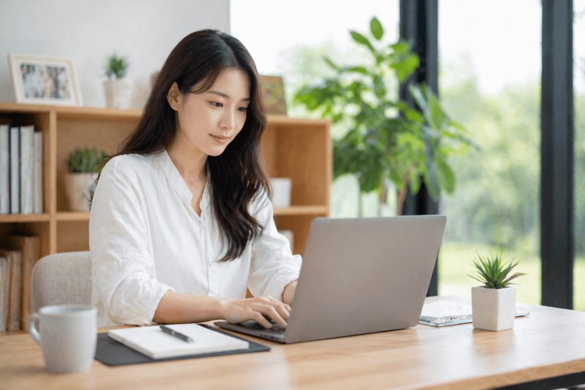 Burnout timing cycle career stagnation: woman at desk working on laptop while inputs produce no outputs during decade transition