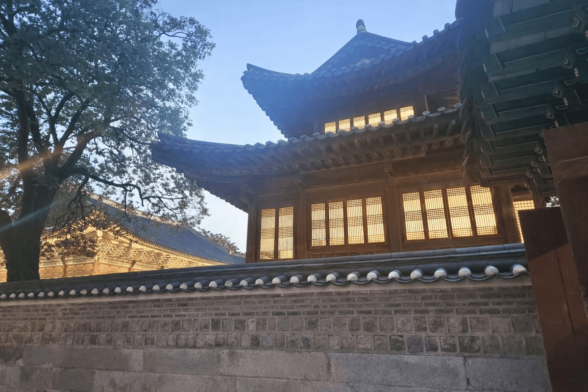spring cycle meaning in astrology — Deoksugung palace windows glowing with golden light at dusk