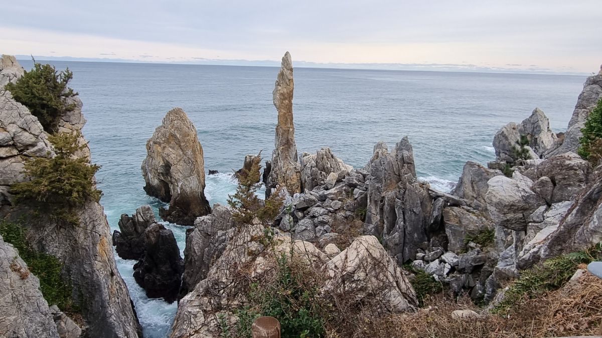 losing yourself in your job — rocky coastal landscape with sea view