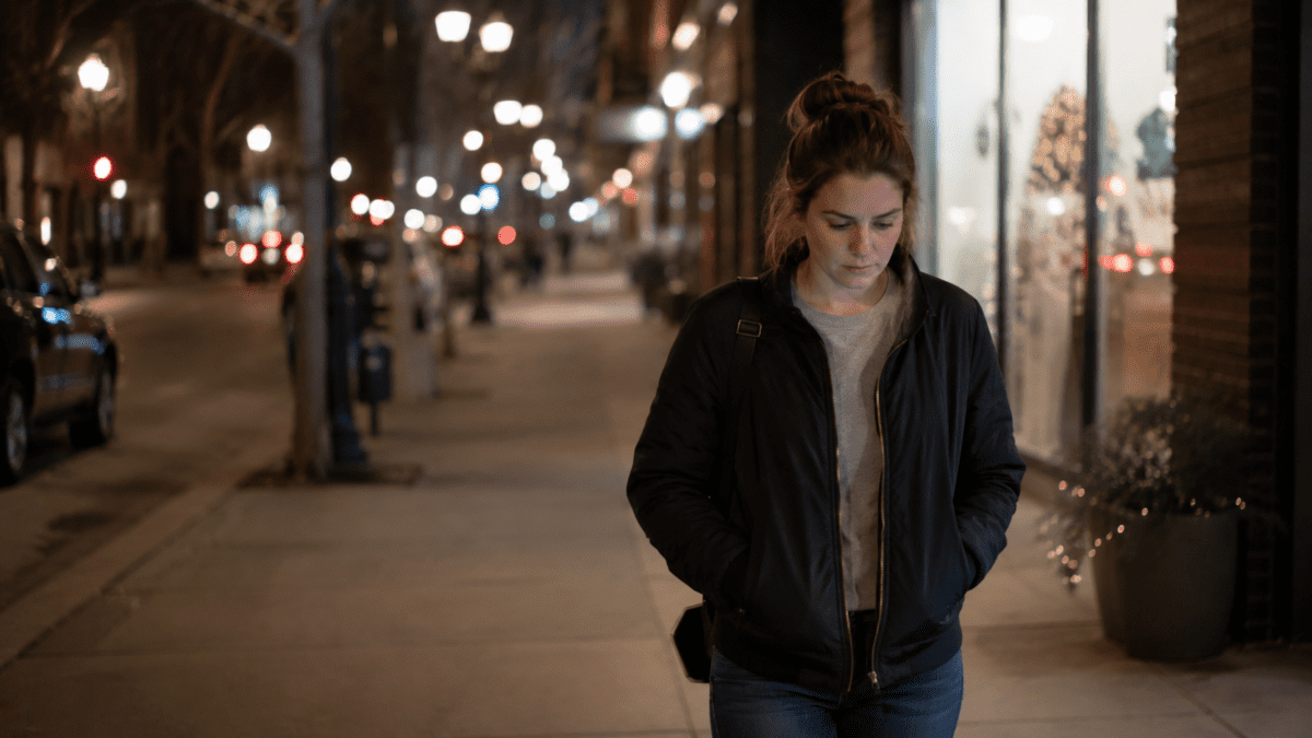 last days before payday — woman walking past evening plans she quietly skipped