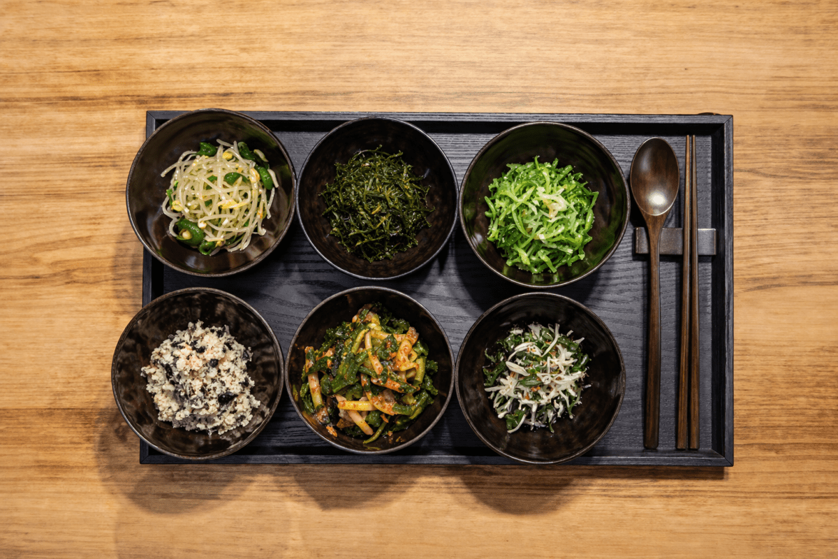 Korean temple food namul side dishes wooden tray overhead view