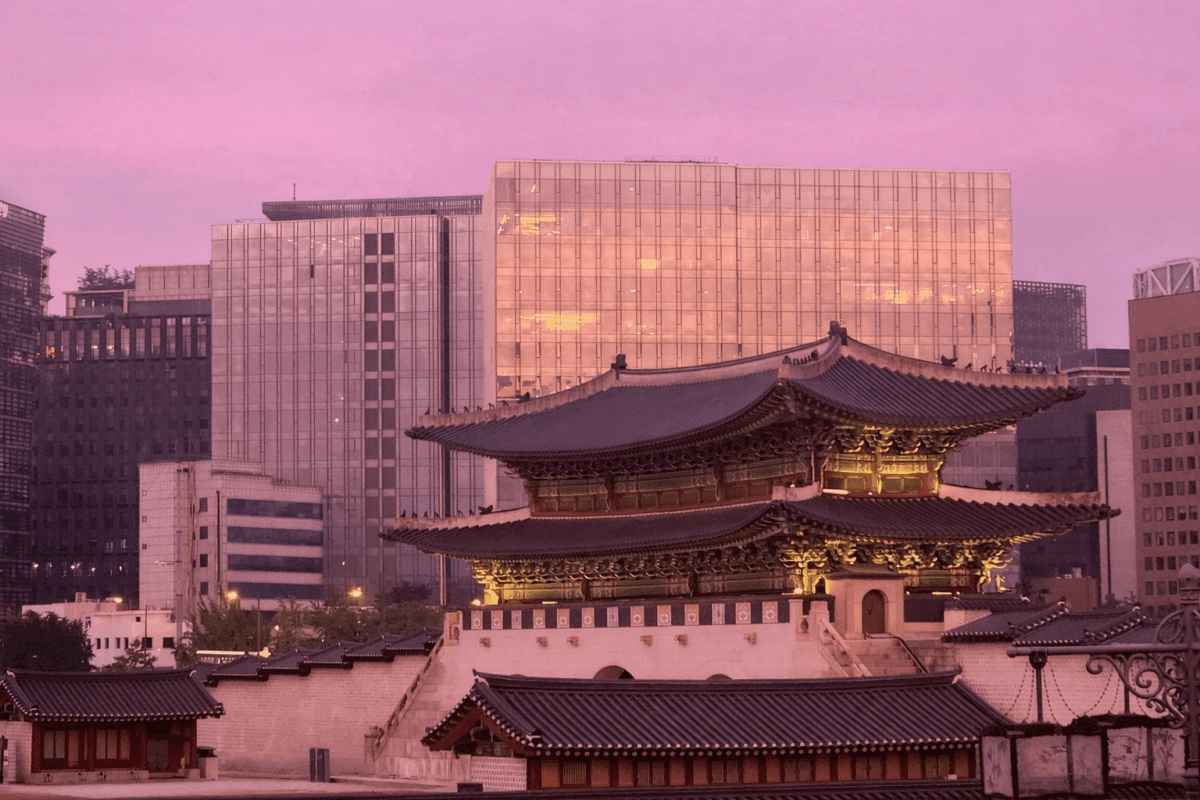 ```
tiger hour meaning in astrology — Gwanghwamun gate lit by pink dawn light against Seoul skyline
```
