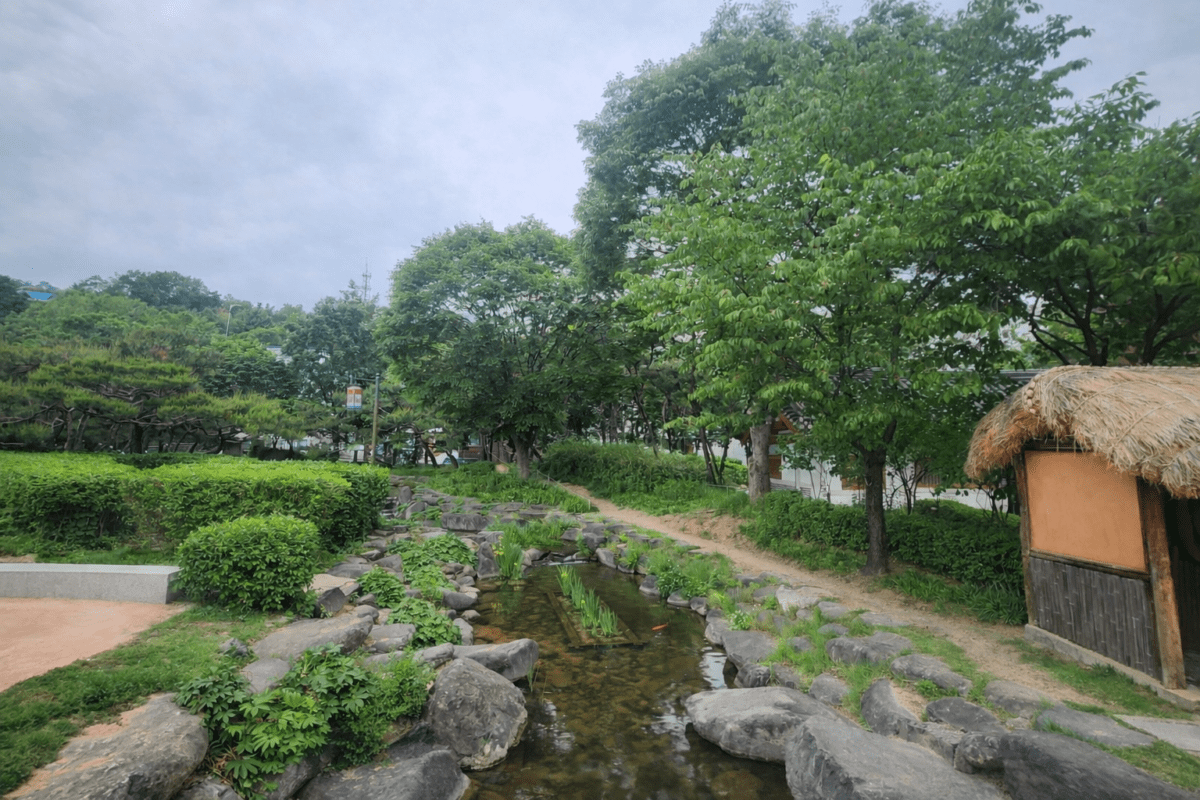 quarter-life crisis structural shift — quiet Korean garden stream showing cycle moving beneath the surface