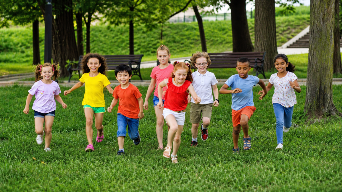 Children running outdoors in a park, representing how school lunch nutrition supports healthy child development over time.