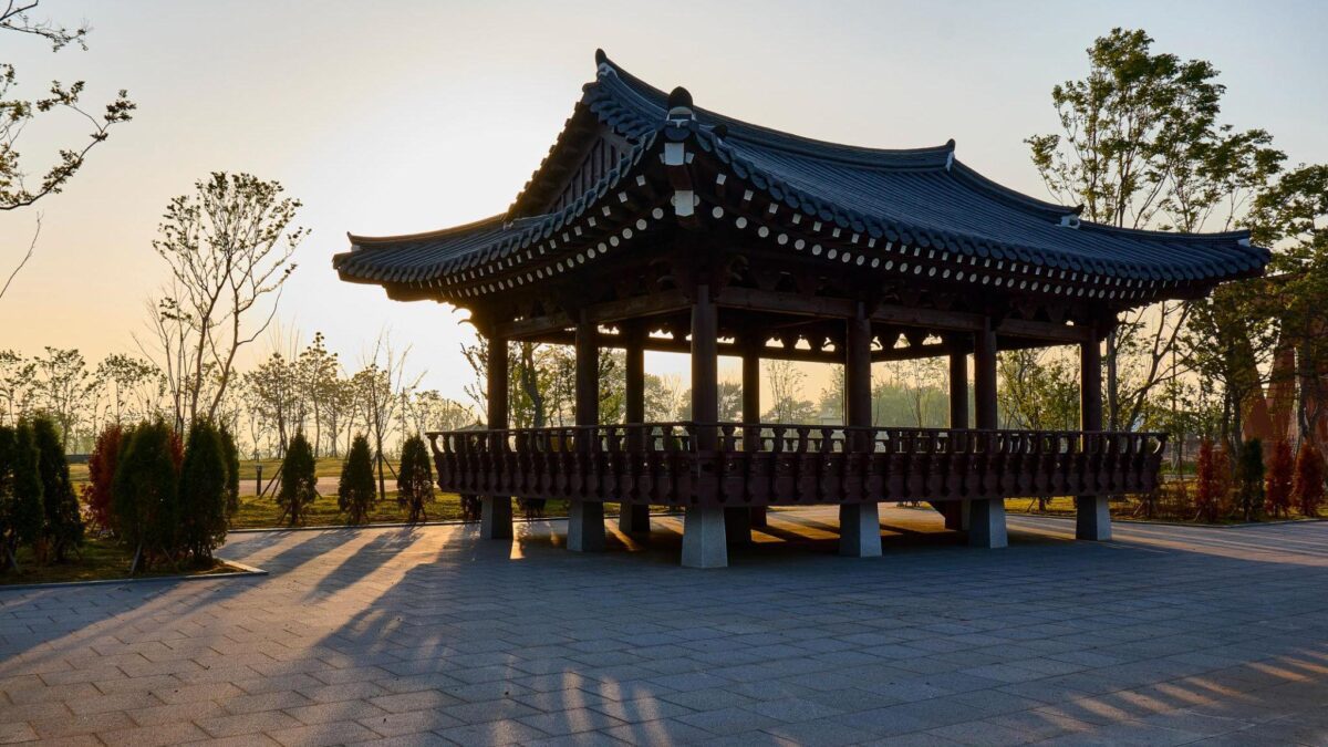 Traditional Korean pavilion at sunset reflecting distance, memory, and displacement connected to Isang Yun's exile.