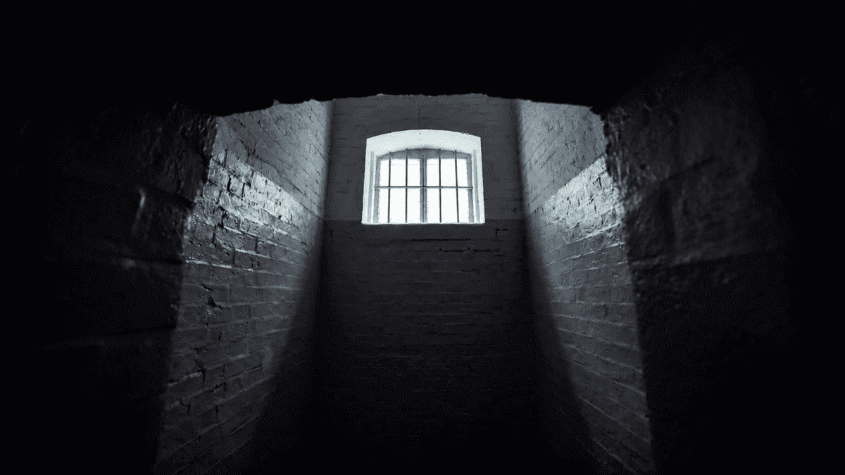 Dark enclosed corridor and barred window reflecting trapped systems and psychological tension in Kim Ki-young cinema.