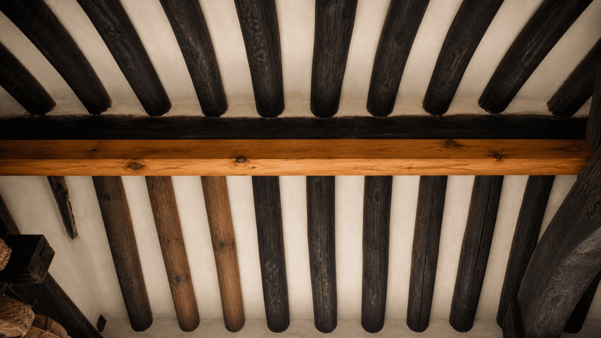 Traditional wooden ceiling beams reflecting repetition, structure, and confined space in Kim Ki-young cinema.