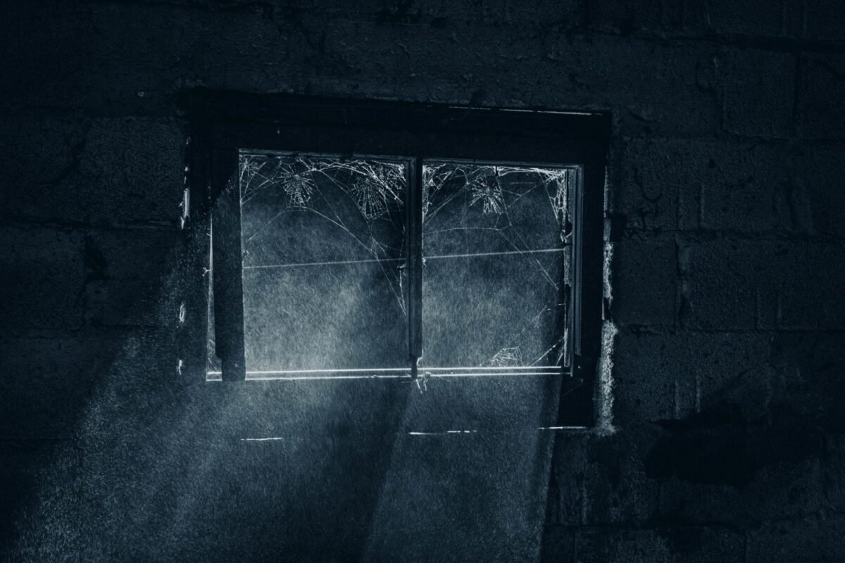Dark window and cold light reflecting the trapped atmosphere and psychological tension found in Kim Ki-young cinema.