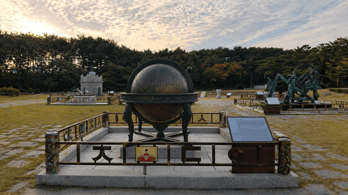 Monument-like installation at sunset symbolizing Nam June Paik television as art and technological transformation