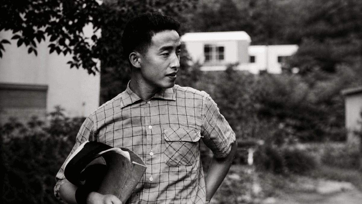 Young Korean artist holds a portfolio of work in the late 1950s — years before television became his instrument.
