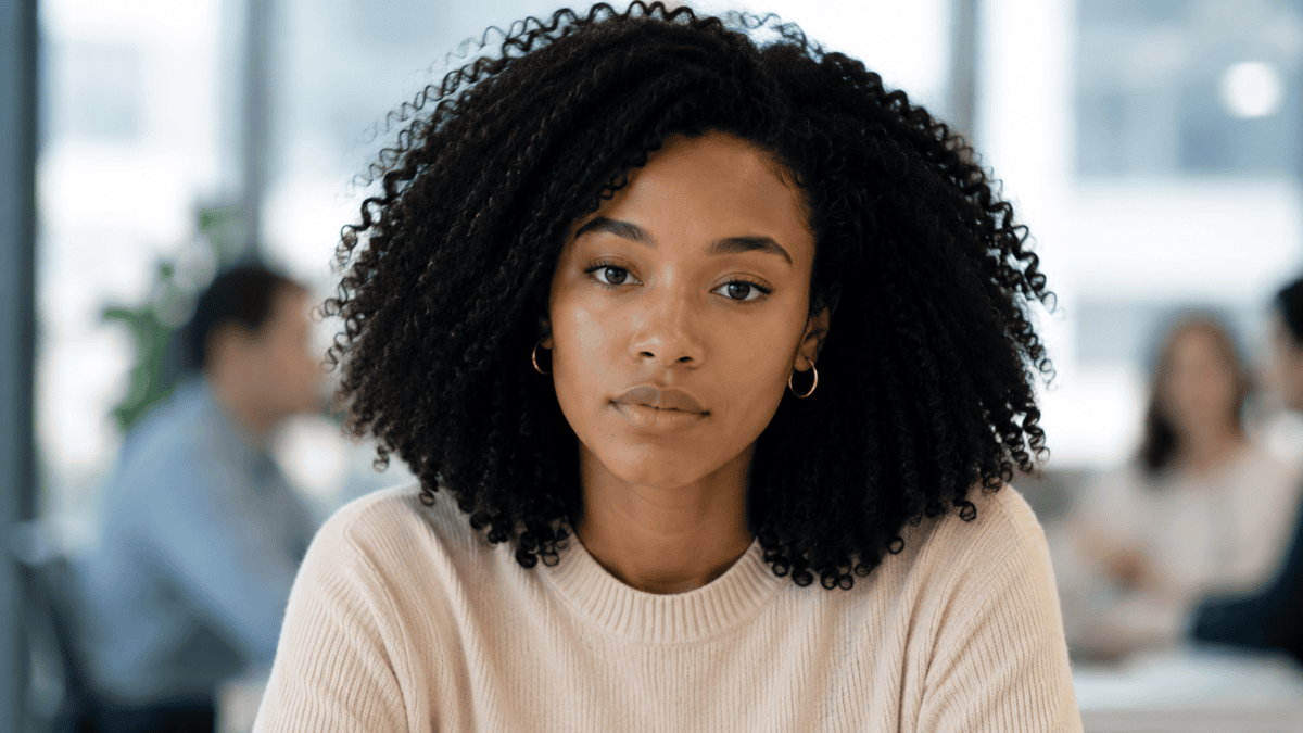 Woman sits across from her manager in a calm, direct talk — naming the gap instead of leaking the signs of quiet quitting.