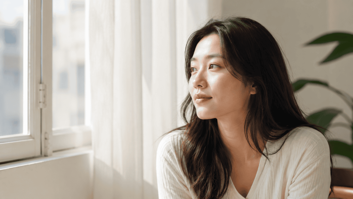 A woman in natural light with refined, understated results, the subtle aesthetic that reads as rest rather than intervention.